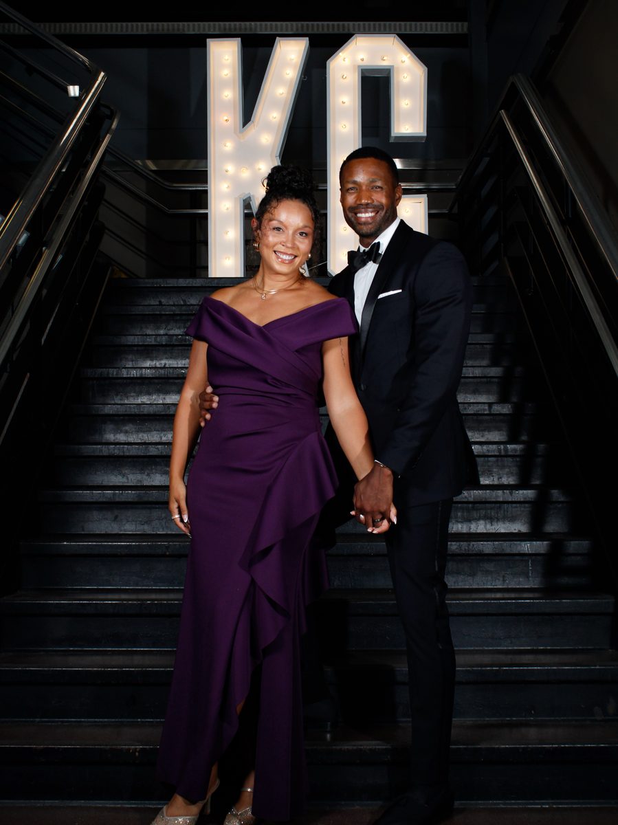 Jordan Criddle and Ciarra at the Vision of Equity Gala staircase